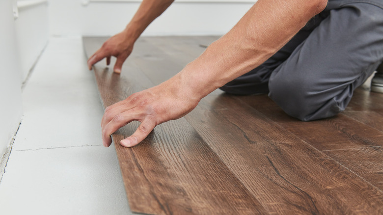 Person installing flooring