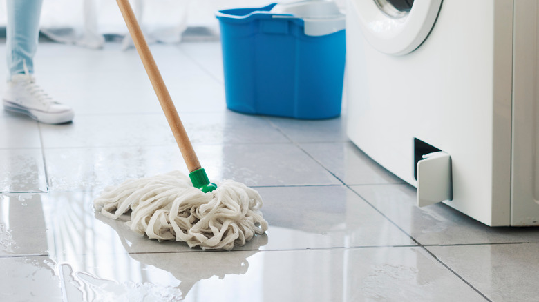 person mopping up a mess