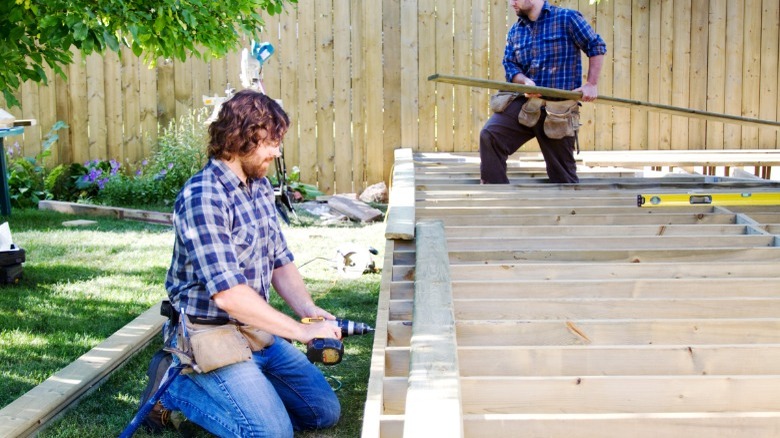 Men building a deck 