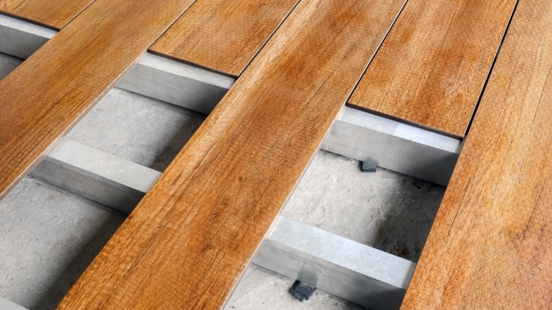 Depicts joists beneath deck flooring 