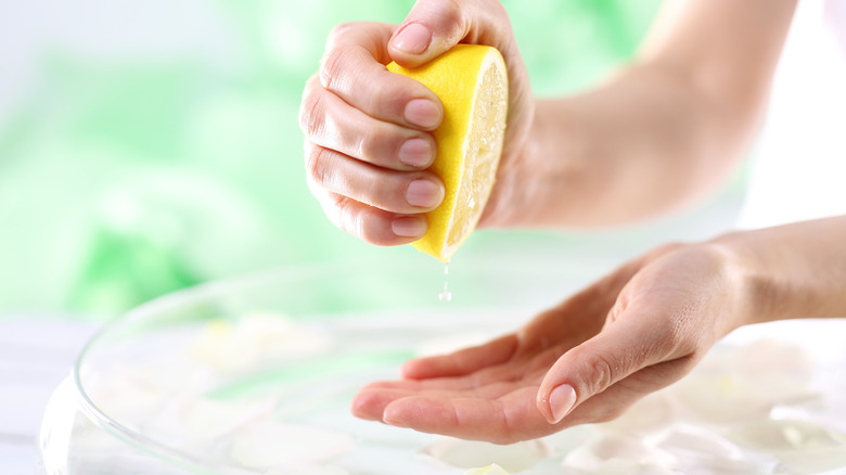 Woman laundering with lemon 