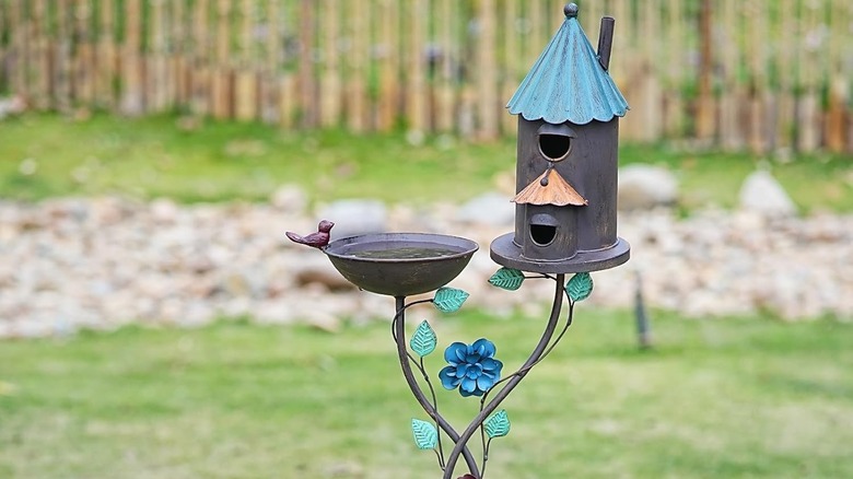 metal bird bath and house