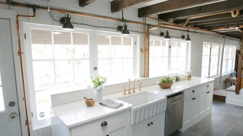 Kitchen with exposed antique copper pipes