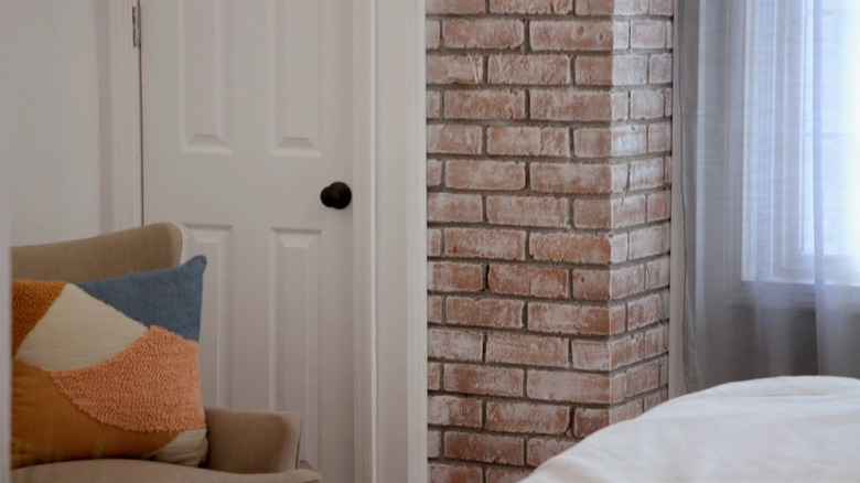 An exposed brick chimney wall