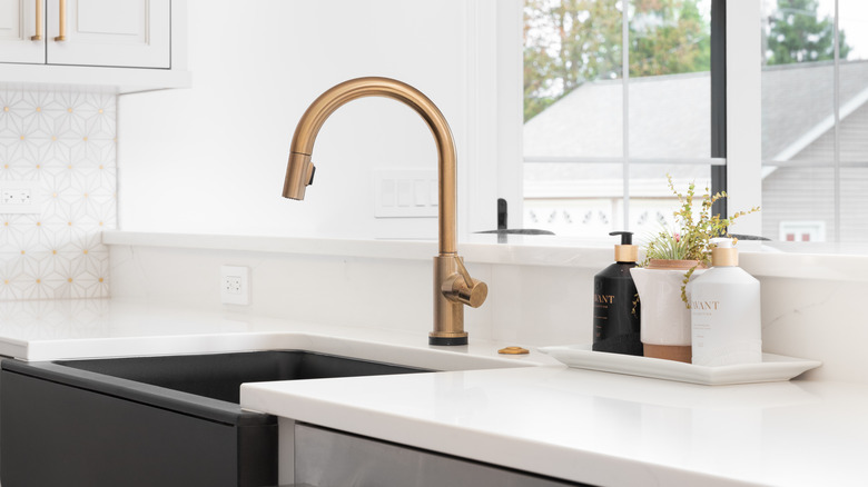 Farmhouse sink with gold faucet