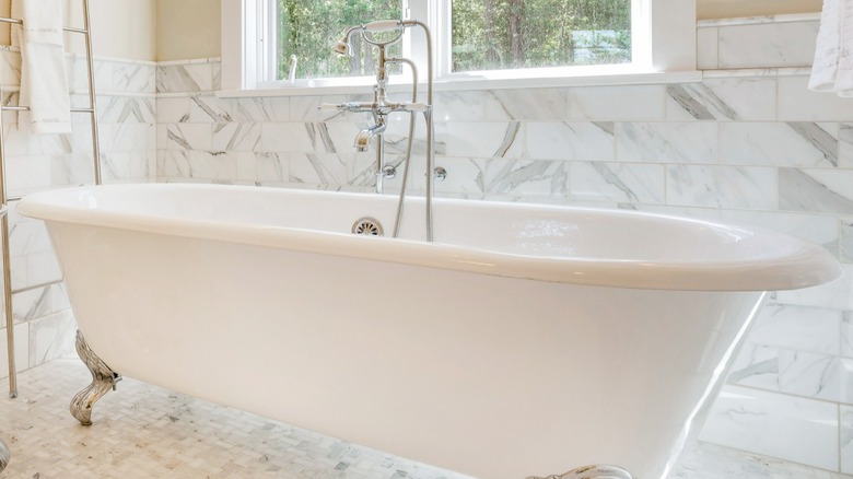 Freestanding tub in bathroom