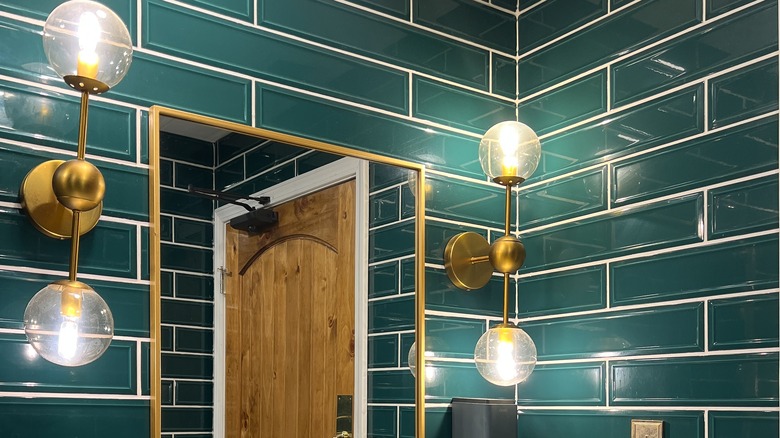 green subway tile bathroom