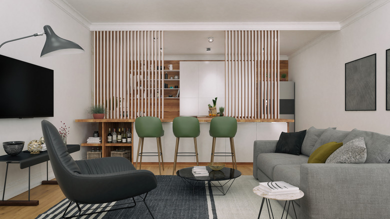 Wood slats separating kitchen from living space