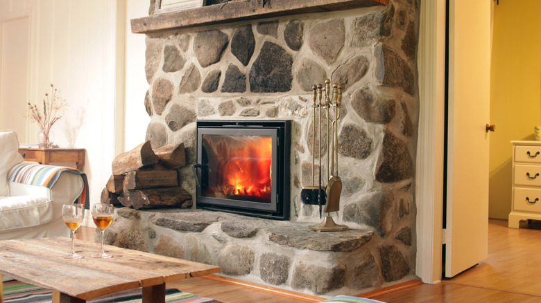 antique rock fireplace in classic living room