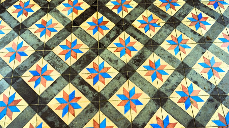 barn quilt tiles on ground