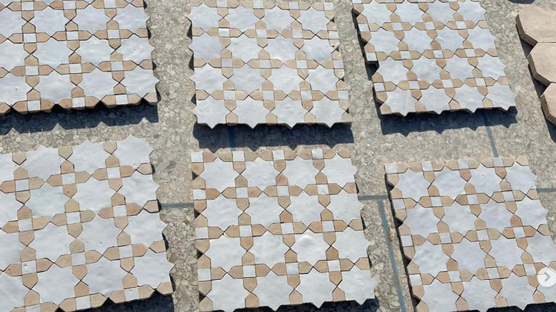 cross and star tiles laid on ground