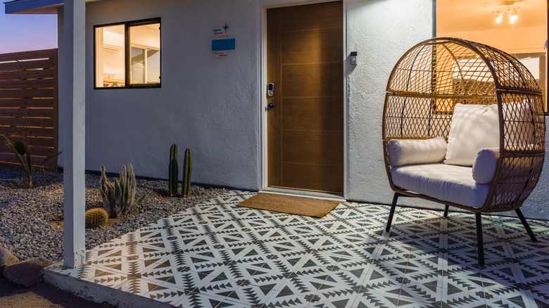 a tiled patio with swing