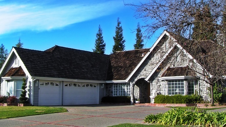 A stone-sided home with 3-car garage