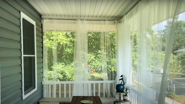 patio with mosquito curtains