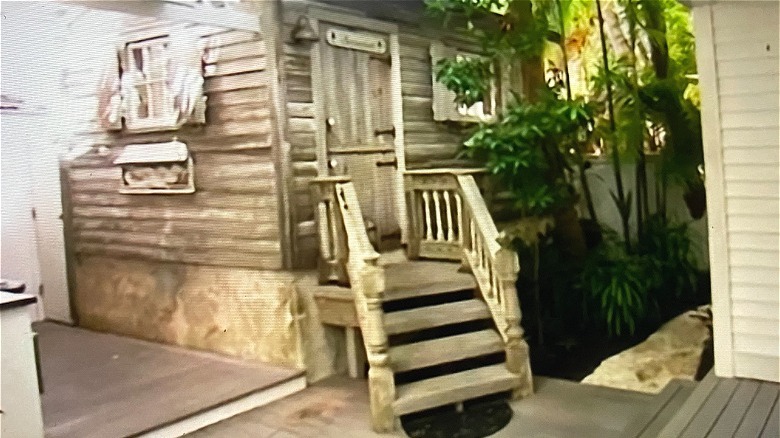 An outdoor pine bathroom