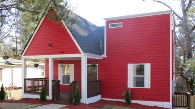 red house with siding exterior