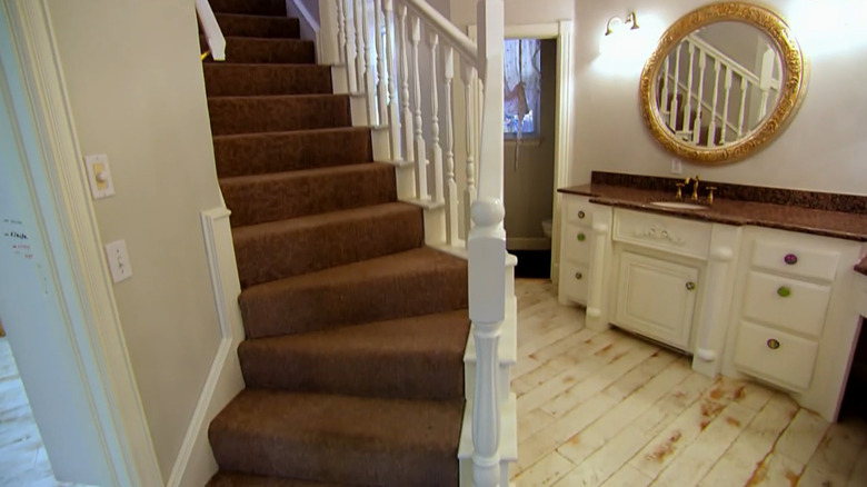 White wooden staircase in bathroom