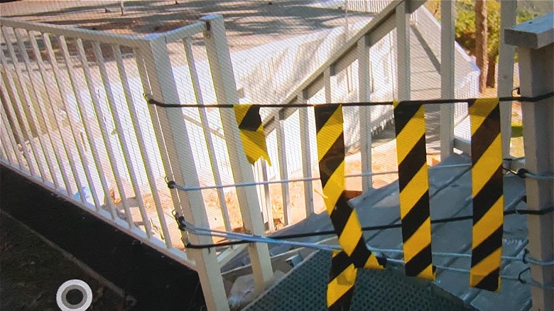 caution tape on outdoor stairs 