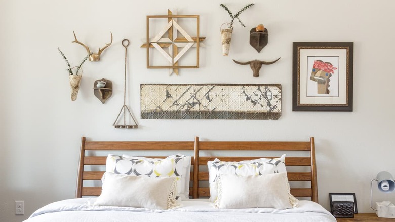 white bed and wall art 