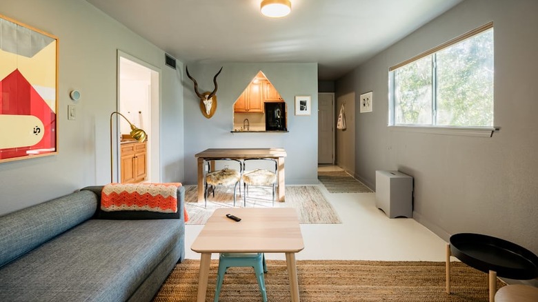 minimalist living room with gray couch