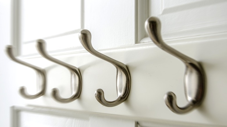 hanging hooks on white door