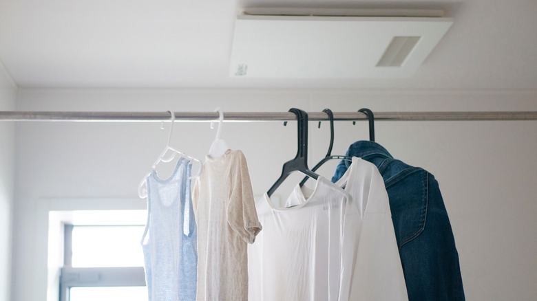 Clothes hanging in laundry room