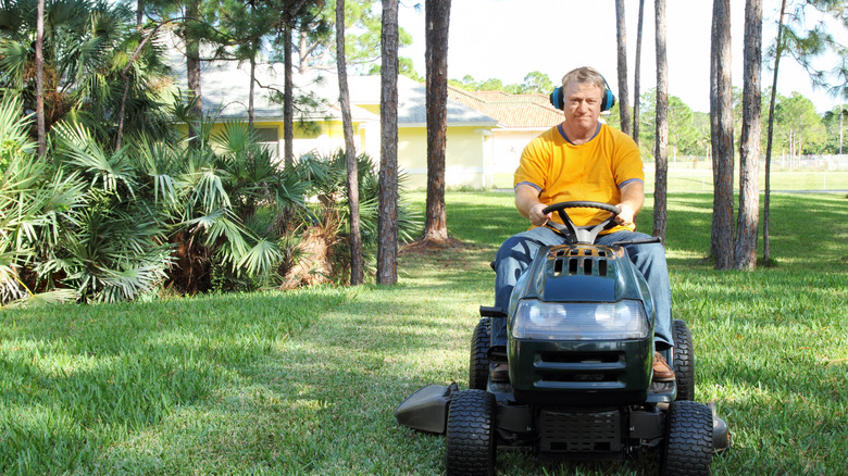 Man mowing lawn in Florida 