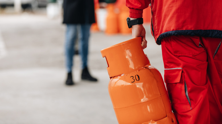 Man carrying gas cylinder