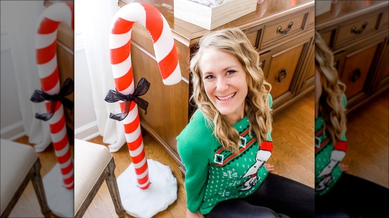 woman sitting by candy cane