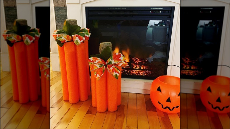 pool noodle pumpkins by fireplace