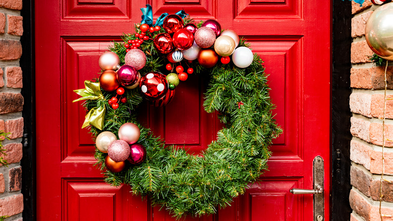 christmas wreath on red door