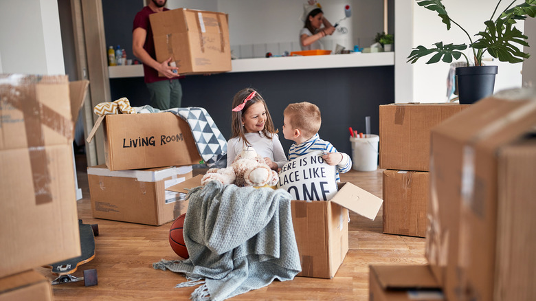 family unpacking boxes