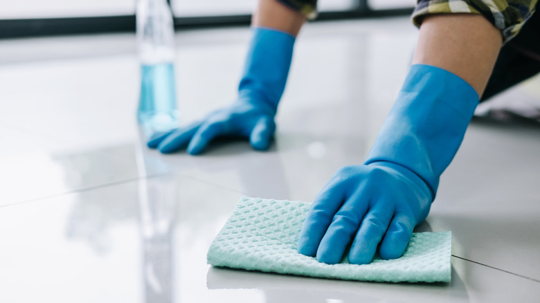 Person scrubbing floor