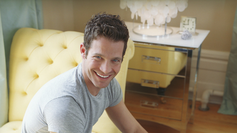 Nate Berkus sitting and smiling