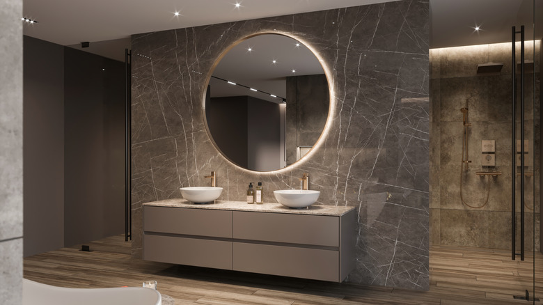 Backlit mirror in modern bathroom