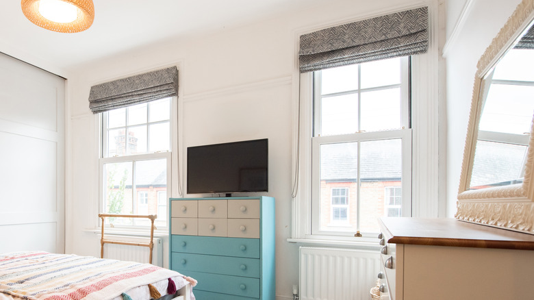 A set of Roman blinds on windows