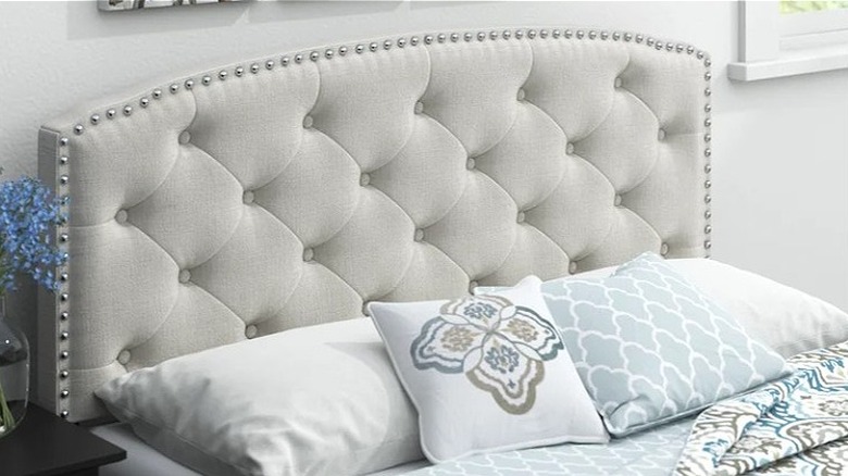 tufted gray upholstered headboard