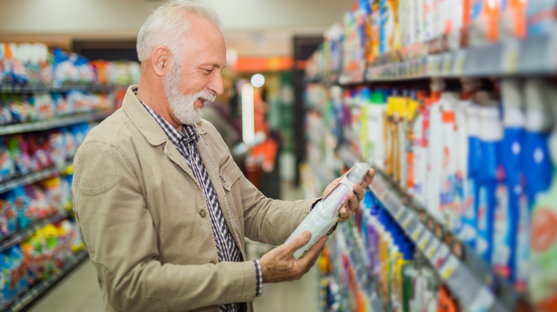 man shopping for cleaning products