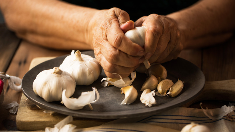 woman peeling garlic