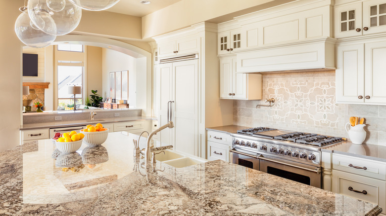 White kitchen with granite countertops