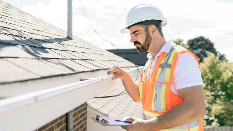 home inspector inspecting roof