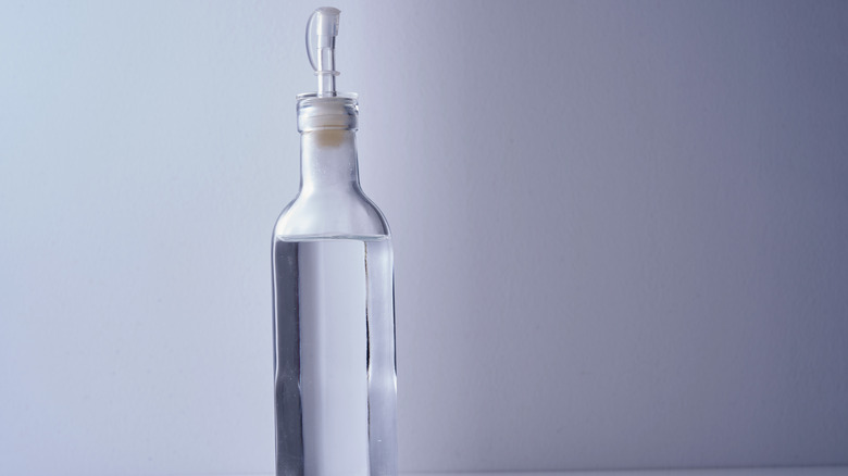 White vinegar in glass bottle 