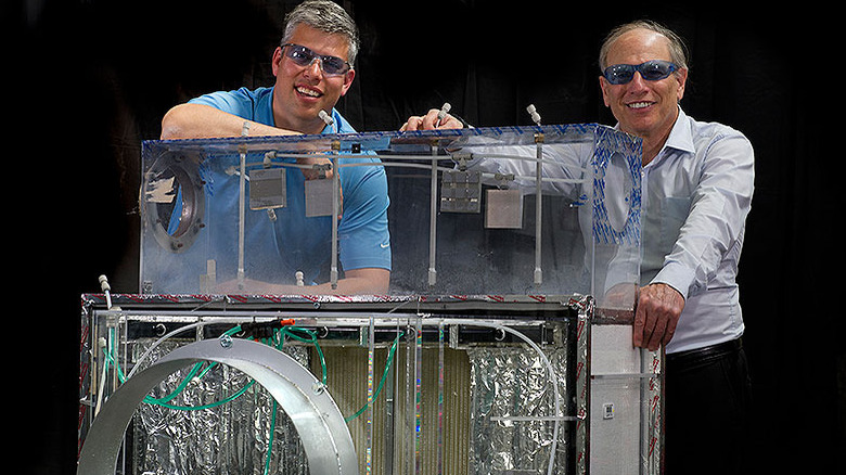 NREL researchers pose with DEVap prototype