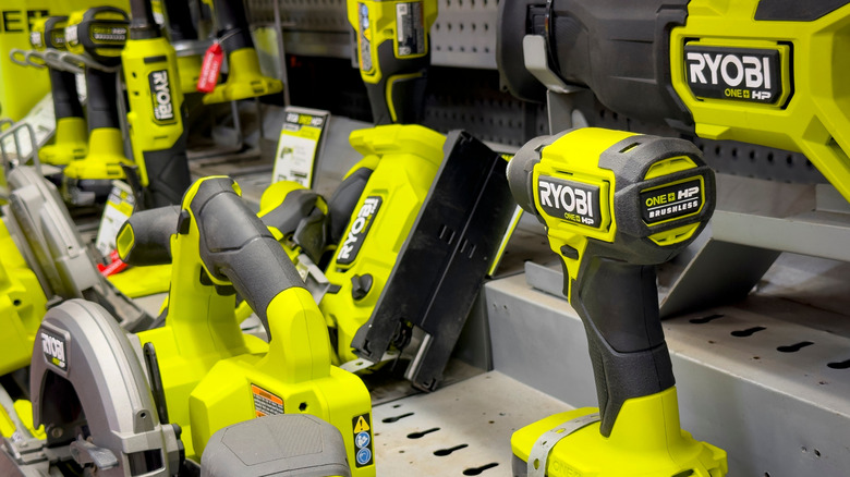 Array of RYOBI tools on a shelf.