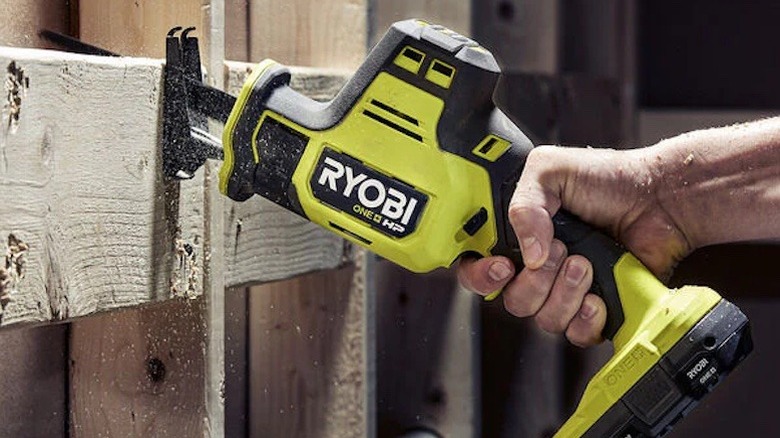 RYOBI handsaw being used on a piece of lumber.