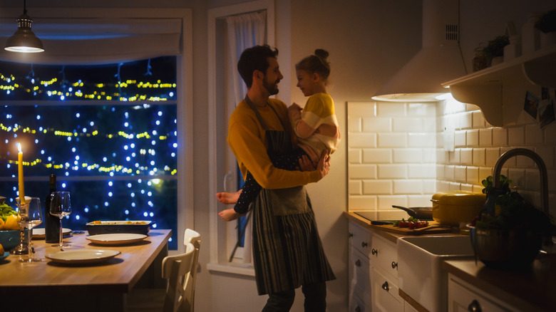 Dad and daughter in kitchen