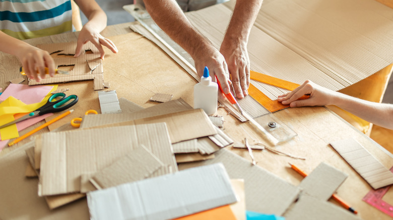 family crafting with cardboard