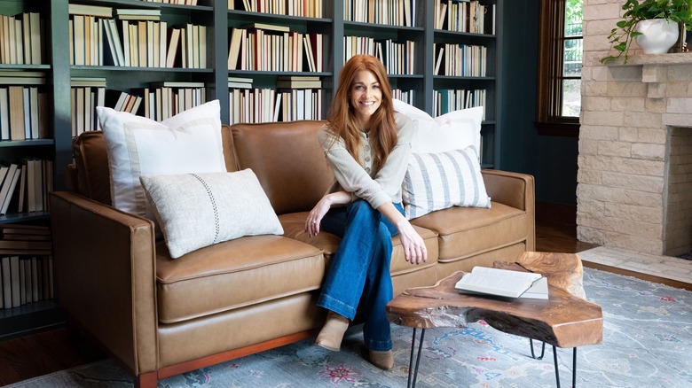 Jenn Todryk sitting on couch in living area