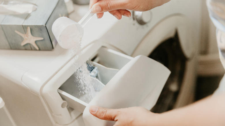 Pouring borax into washer