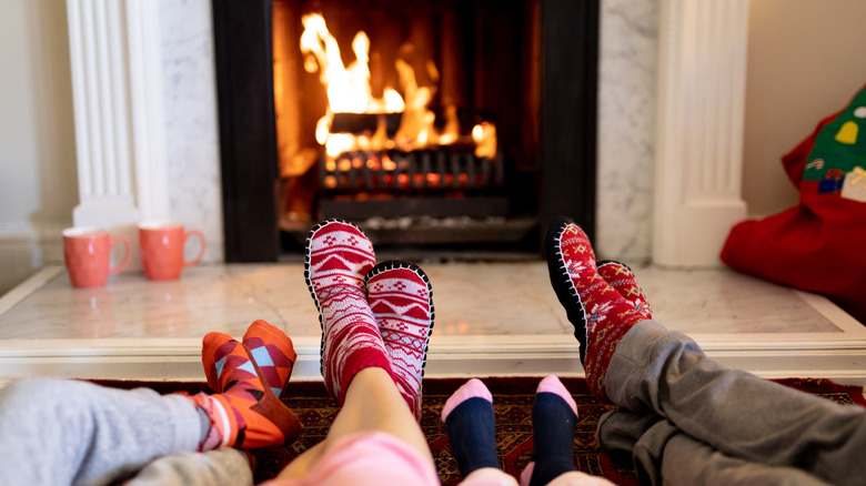 Feet in front of an open fire